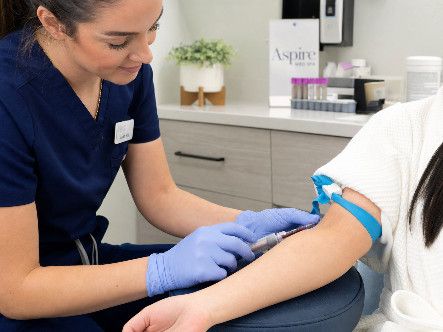 Licensed nurse performing a professional blood draw